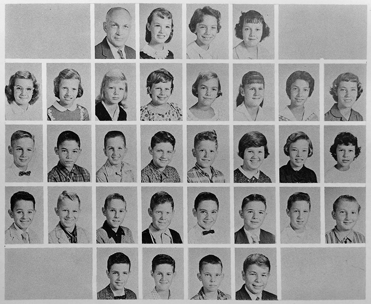 Page from 1957 to 1958 yearbook showing Mr. George Leyda's class of seventh graders. The head-and-shoulder portraits are printed in black and white and are arranged in five rows. 31 children and their teacher are pictured. The portraits are separated with the girls in the top-most rows and the boys in the bottom rows.  