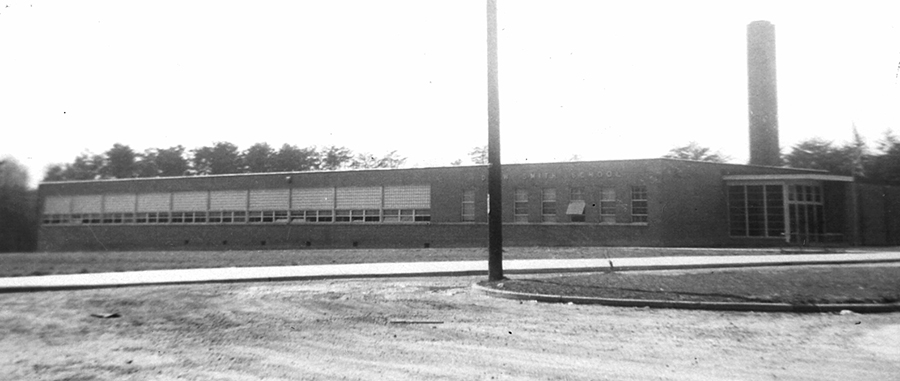 Black and white photograph of Drew-Smith Elementary School. The building is a single-story concrete structure with a brick veneer. It had much fewer classrooms and fewer amenities than the schools built for white children during this time period. 